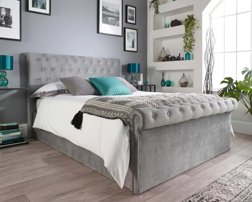 Product photograph of Grey Velvet Scroll Top Chesterfield Ottoman Storage Bed from Aspire Furniture LTD