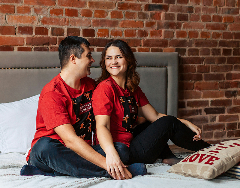Couple sitting on bed