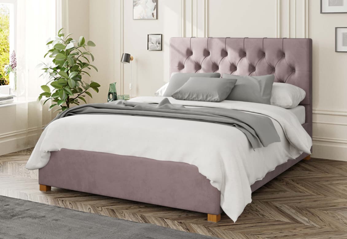 A stylish bed featuring a pink headboard